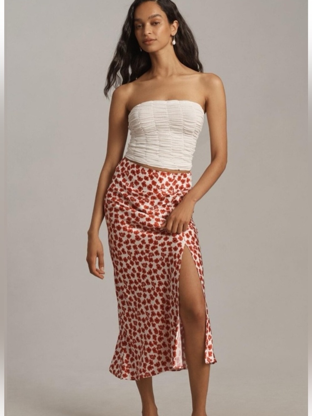 Anthropologie’s Maeve White and Red Floral Midi Skirt with Side Slit.